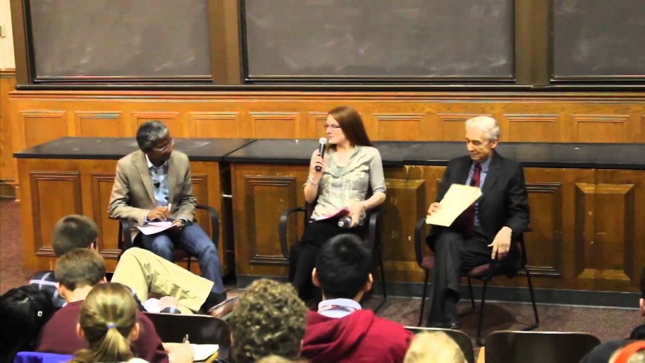 Panel discussion at university auditorium.